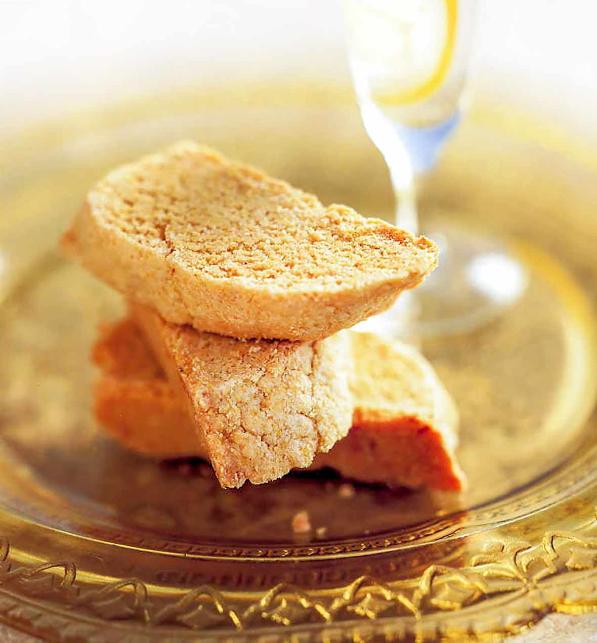 The half-moon biscotti cookies on a yellow glass plate