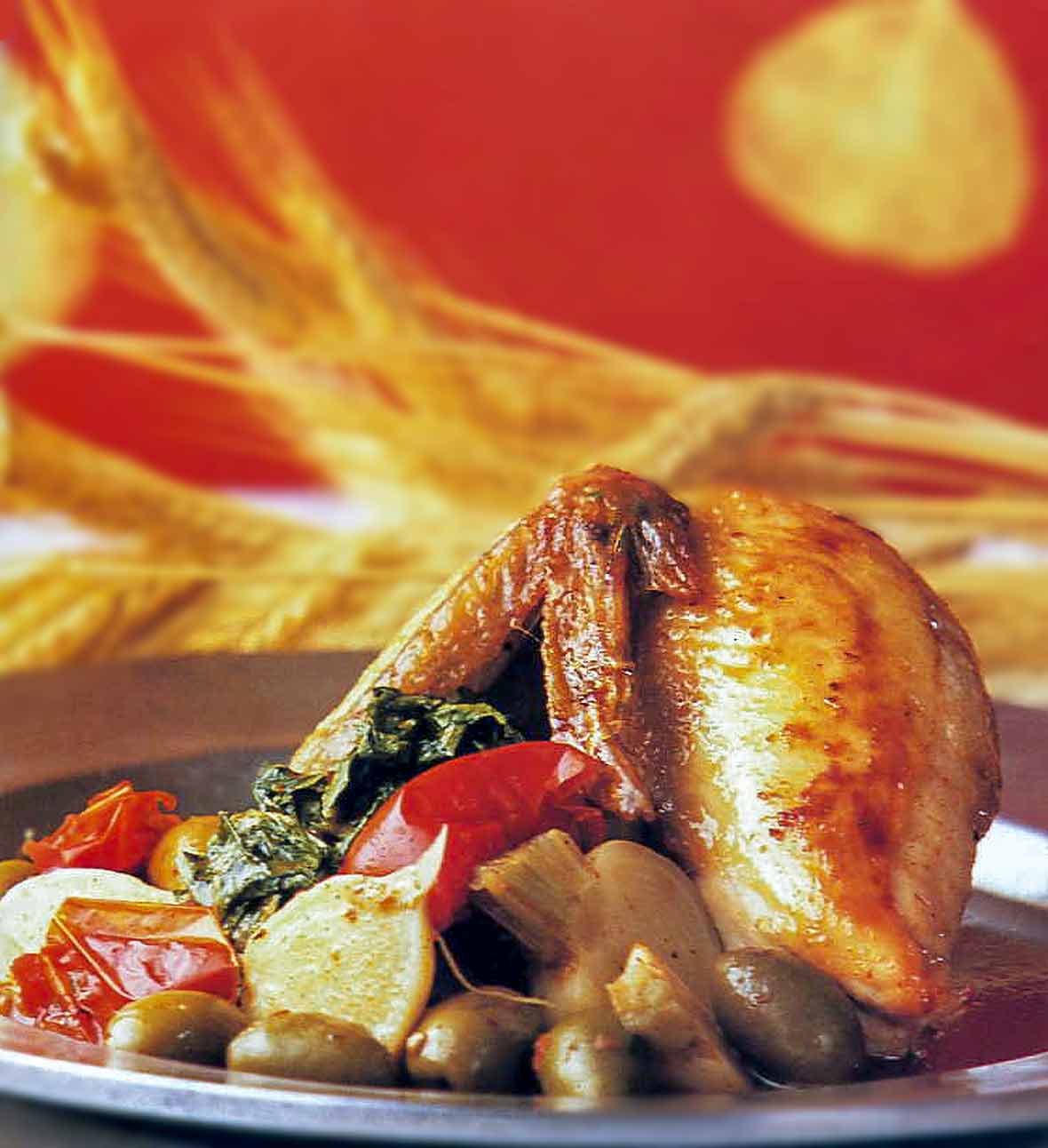 Half baked chicken With olives, turnips, and turnip greens on a plate