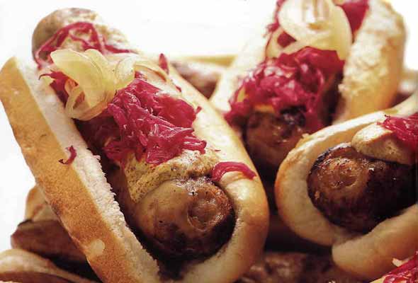 beer-simmered bratwurst with onions and sauerkraut
