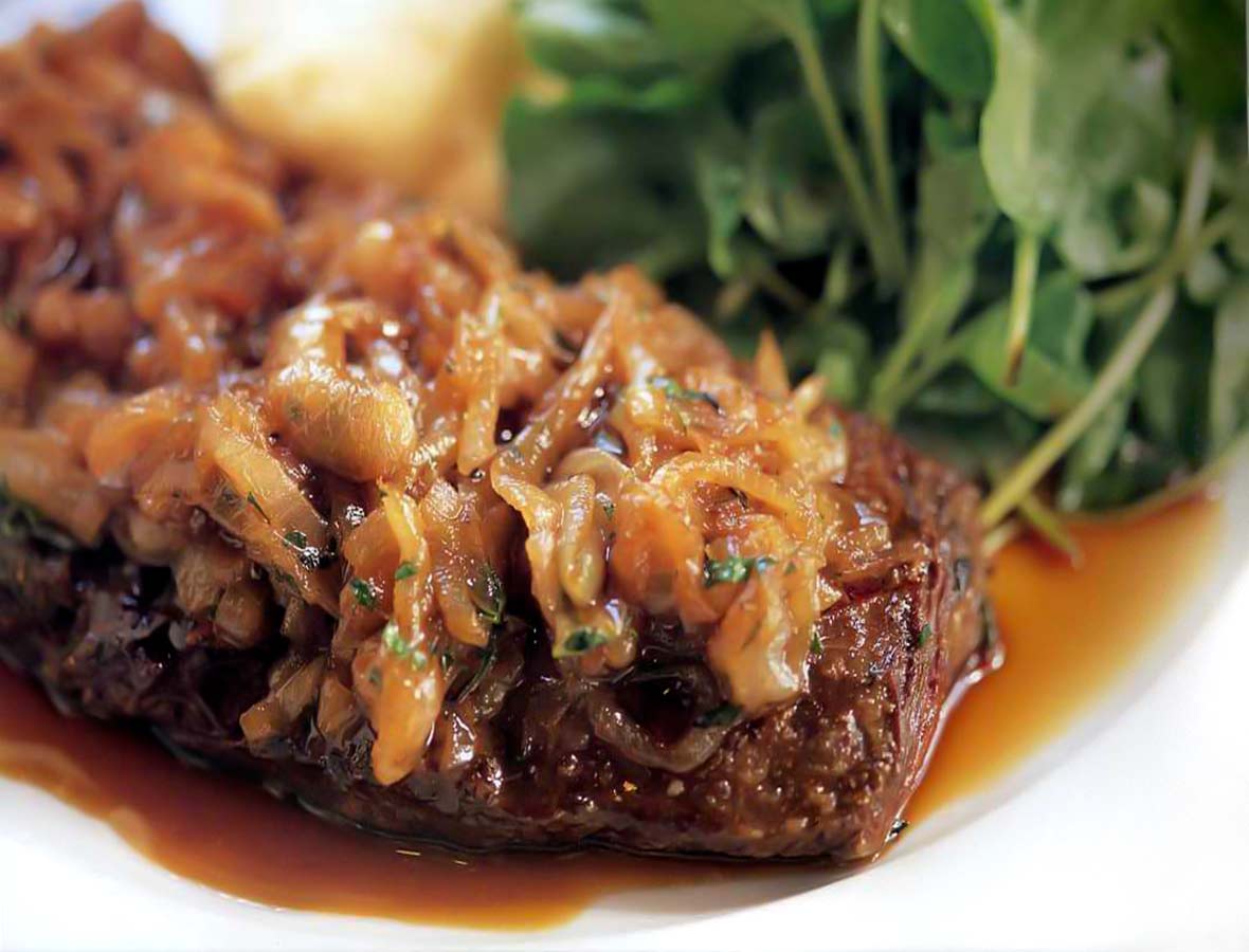 Skirt steak with caramelized shallots