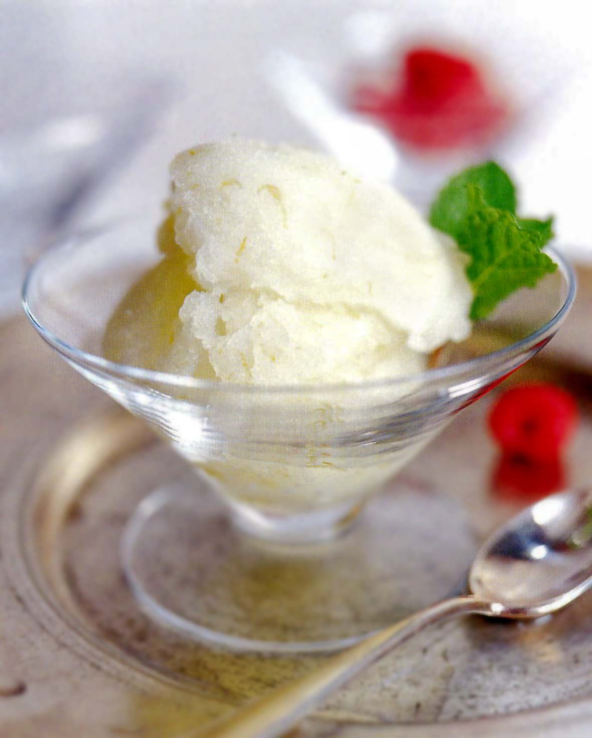 Glass of fresh lime ice served with berries on the side