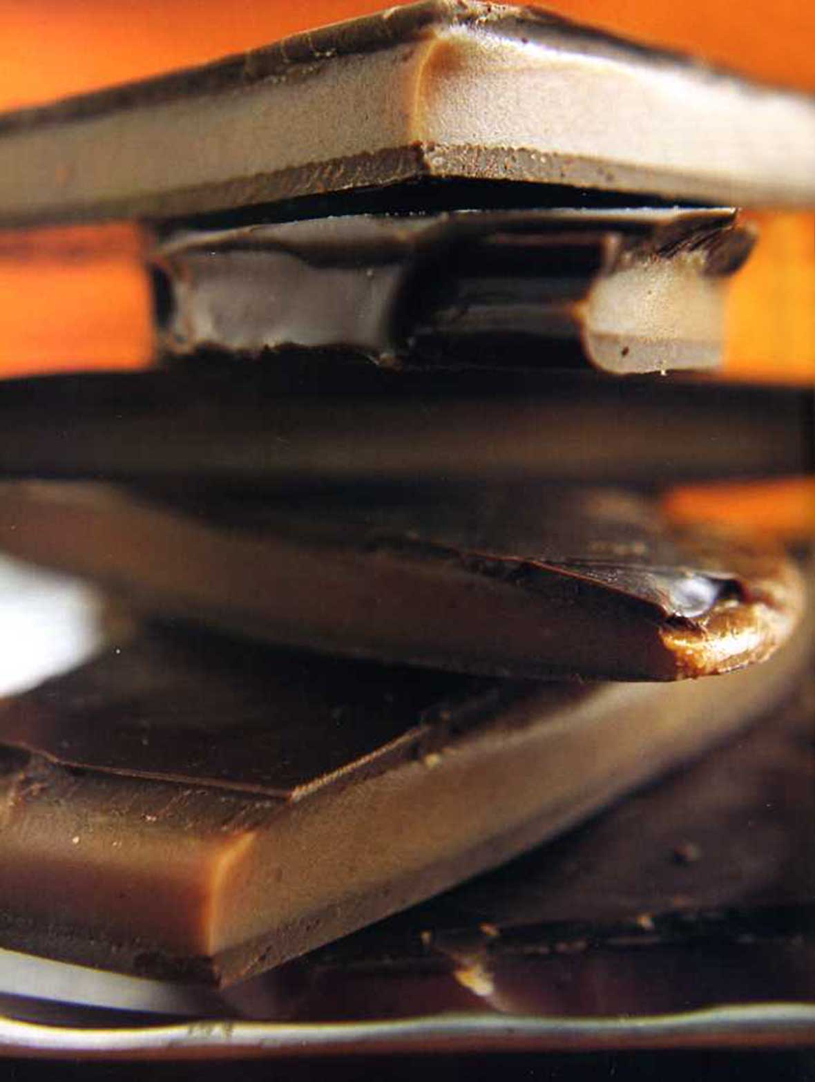 Pieces of chocolate peppermint toffee stacked on top of each other.