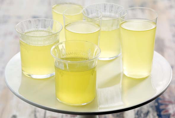A table topped with five lemon-herbsaint poppers.
