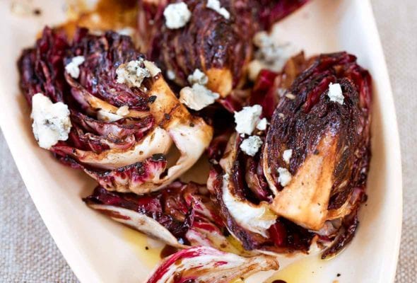 Oval plate with a grilled radicchio salad, Gorgonzola, and balsamic vinaigrette