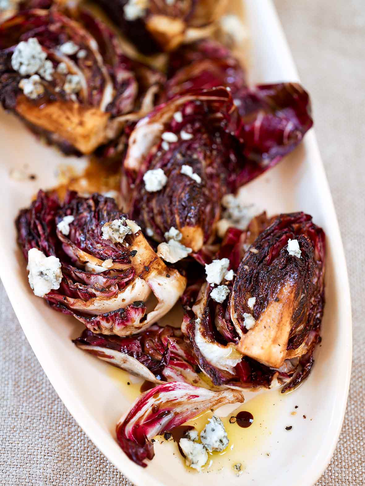 Oval plate with a grilled radicchio salad, Gorgonzola, and balsamic vinaigrette