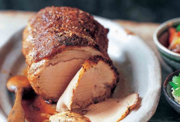 Szechuan spice-rubbed pork loin covered with ground Szechuan peppercorns, condiments on the side