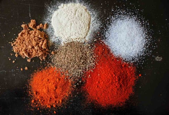 Small piles of the individual spices that make up Quito's barbecue butt rub.