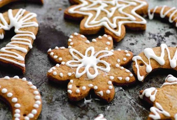 Assorted shapes of decorated sugar Christmas snow cookies.