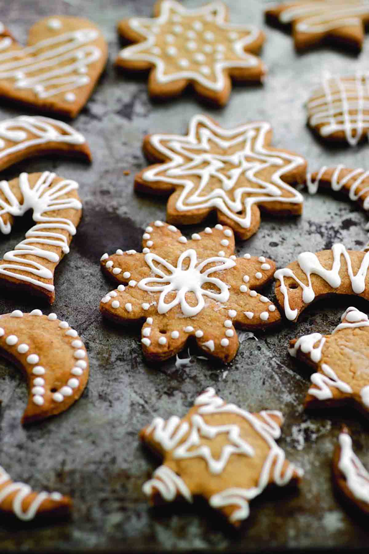 Assorted shapes of decorated sugar Christmas snow cookies.