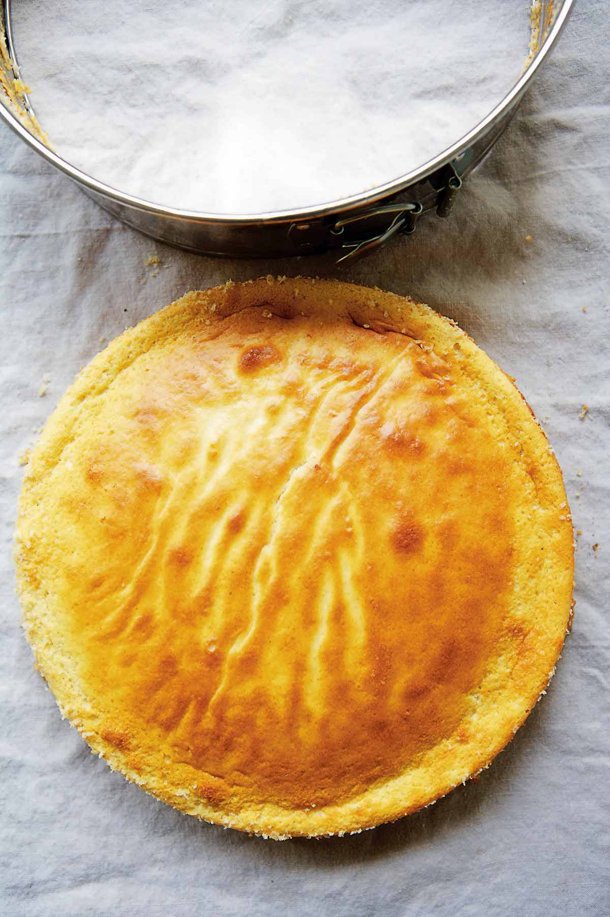 A ricotta cheesecake on a piece of parchment
