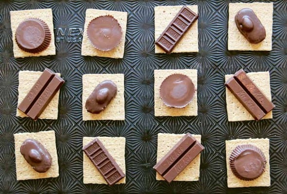 12 graham crackers topped with snack size candy bars to make candy bar s'mores.