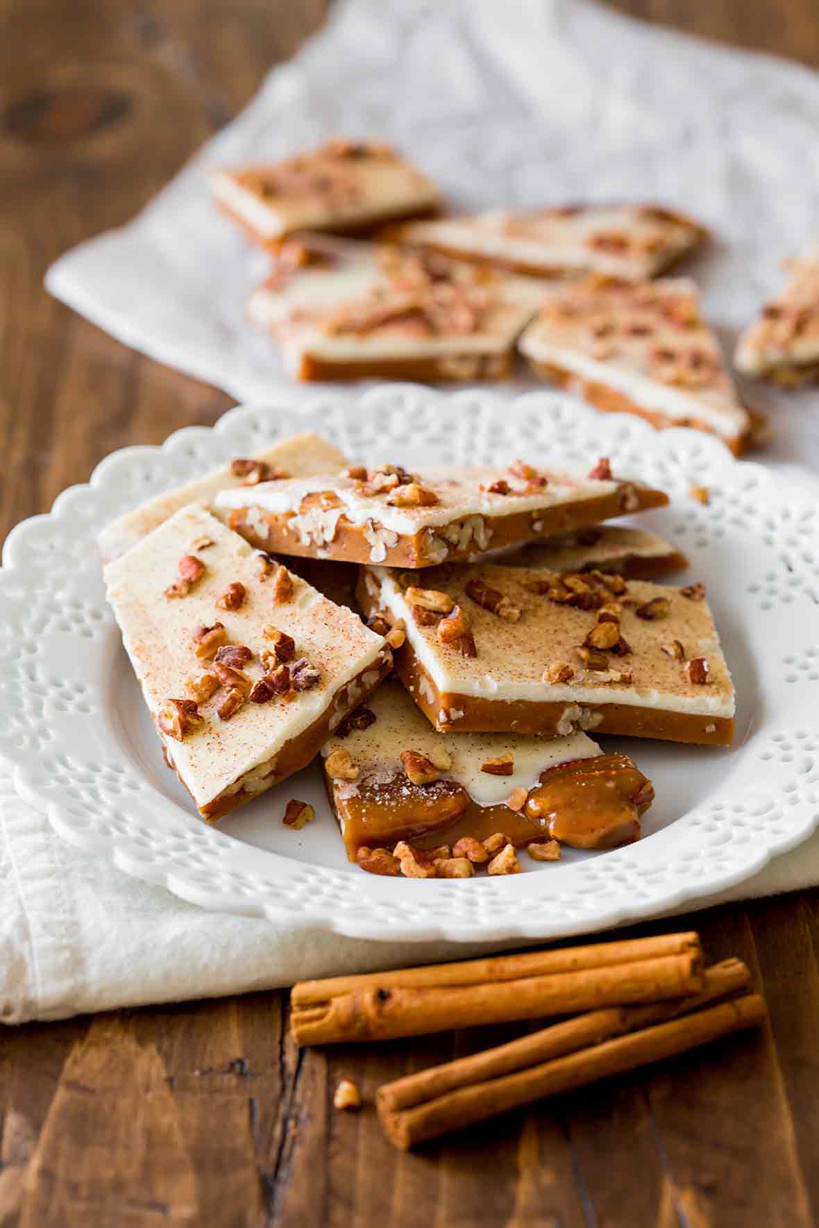 Plate of pumpkin spice toffee--made with toffee, pumpkin spice, white chocolate, and pecans