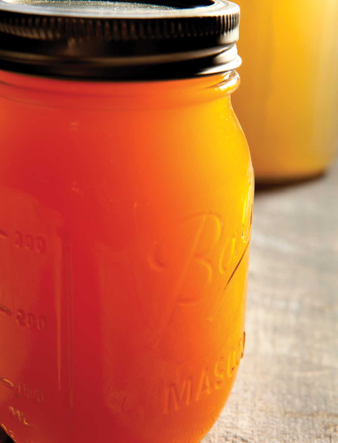 A few Mason jars filled with chicken bone broth.