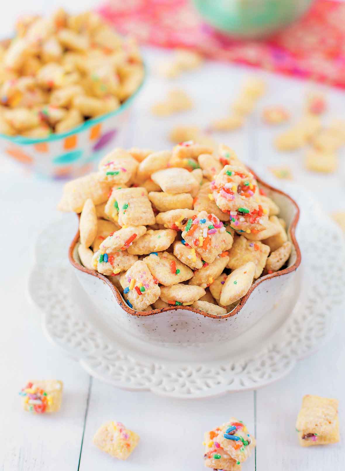 Two bowls of chex mix coated in funfetti