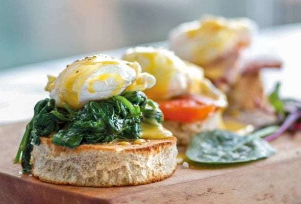 Eggs Florentine--a round of butter toast topped with creamed spinach, poached egg, and Hollandaise sauce