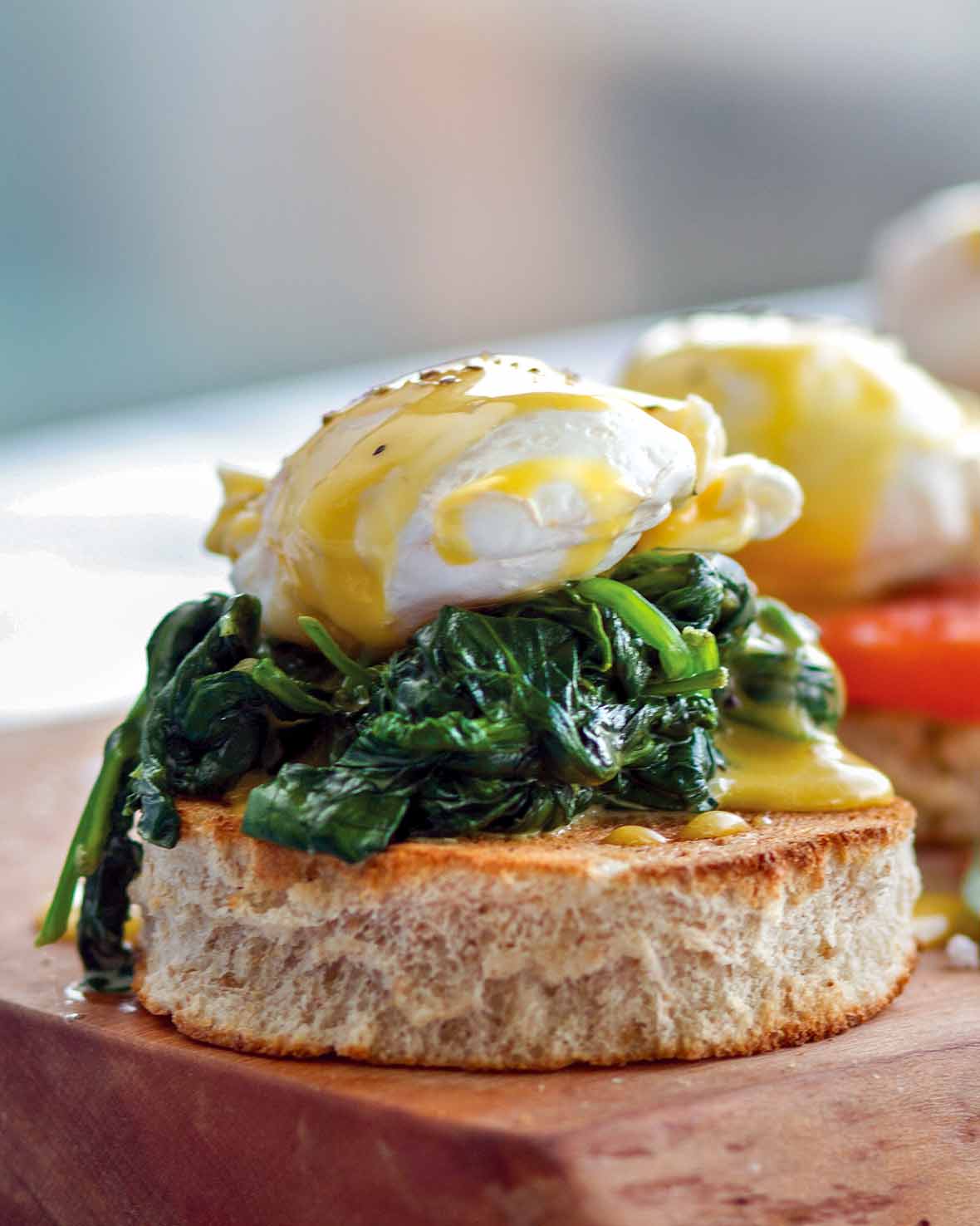 Eggs Florentine--a round of butter toast topped with creamed spinach, poached egg, and Hollandaise sauce