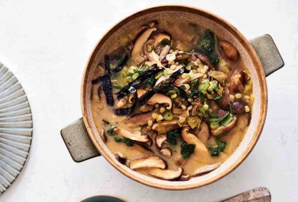 A crock filled with shiitake barley soup--mushroom, leeks, miso, ginger, scallions, nori seaweed