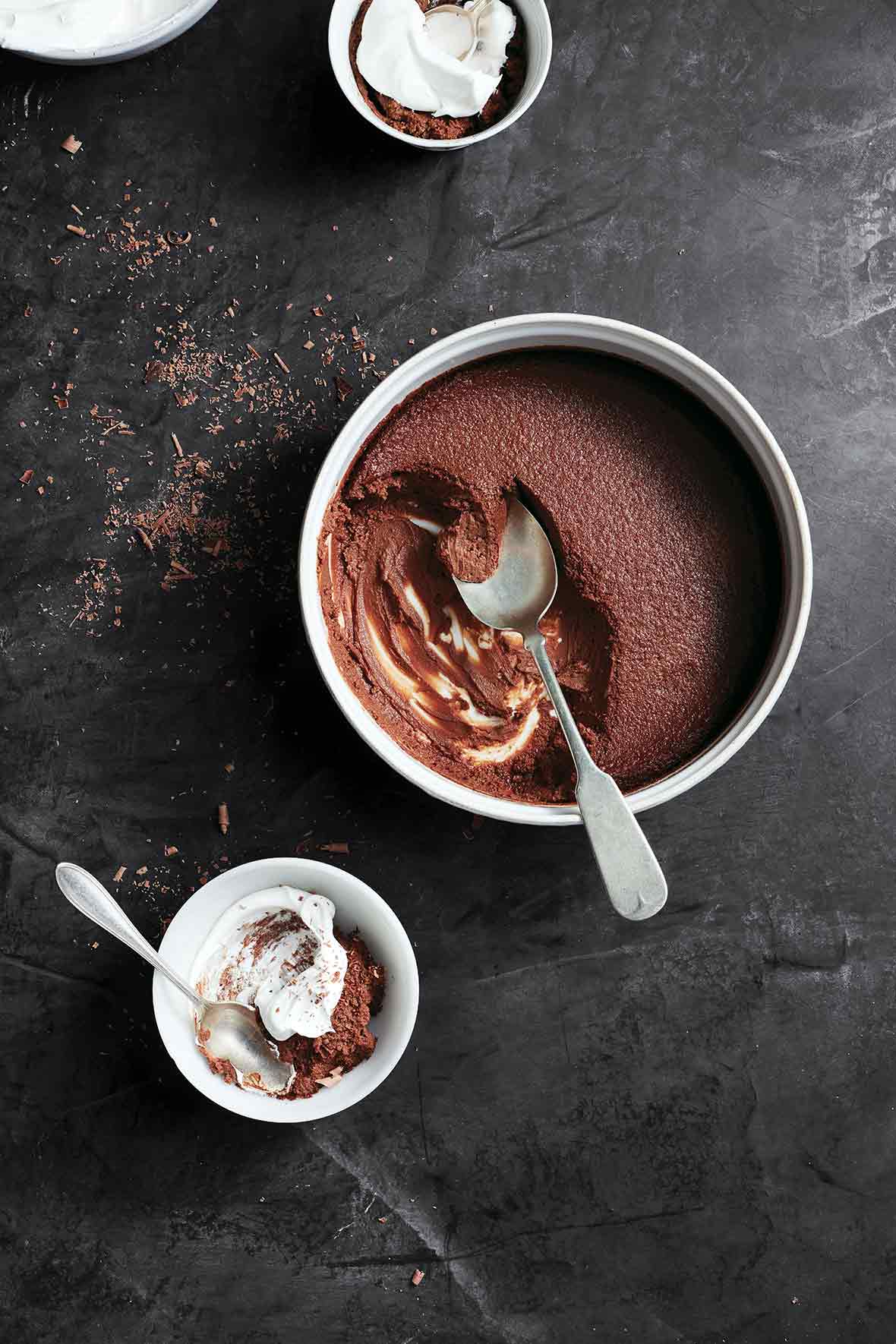 A large dish of pressure cooker bittersweet chocolate pudding, some of it scooped out into a smaller dish