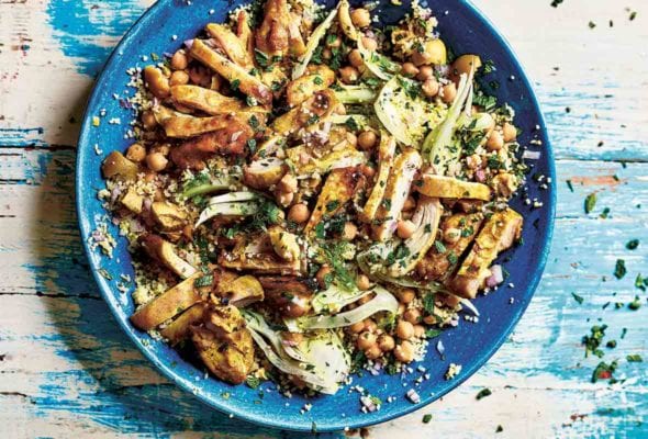 A blue bowl filled with chicken and preserved lemon salad