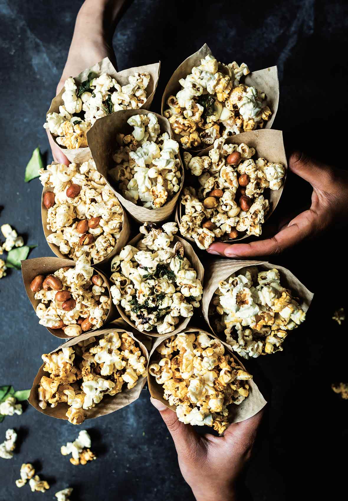 Ten bags of spiced popcorn with assorted flavors