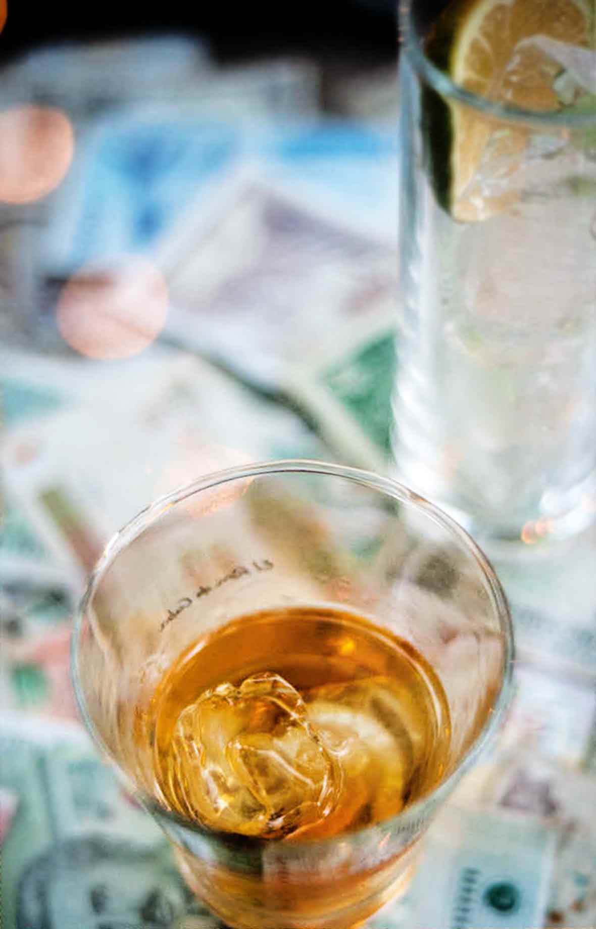 An overhead view into a glass of canchanchara with ice.