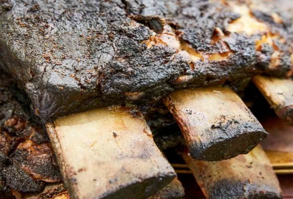 Two slabs of bone-in smoked beef ribs.