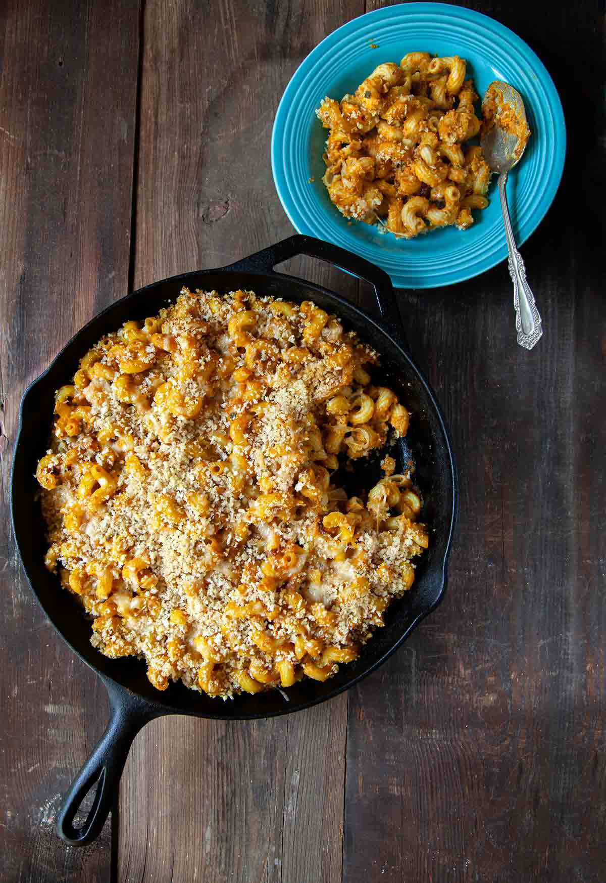 A cast-iron skillet filled with pumpkin mac and cheese
