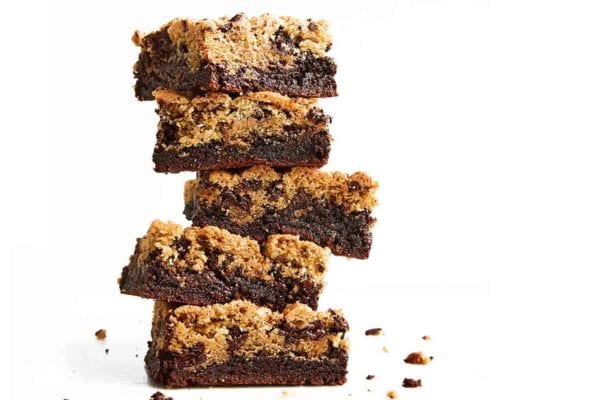 A stack of five chocolate chip cookie brownies.