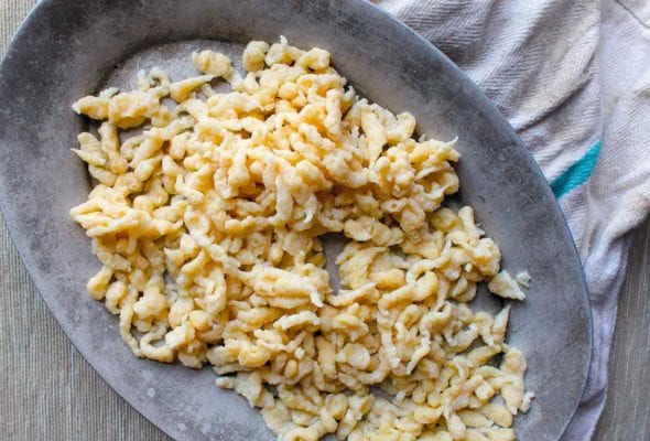 An oval platter filled with homemade spaetzle.
