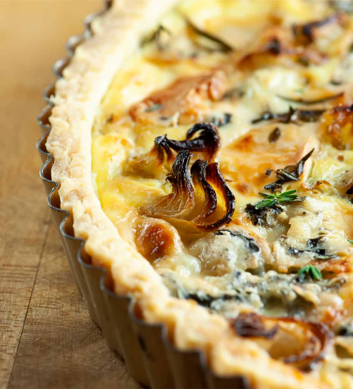 A cooked cipollini and bleu de gex tart.