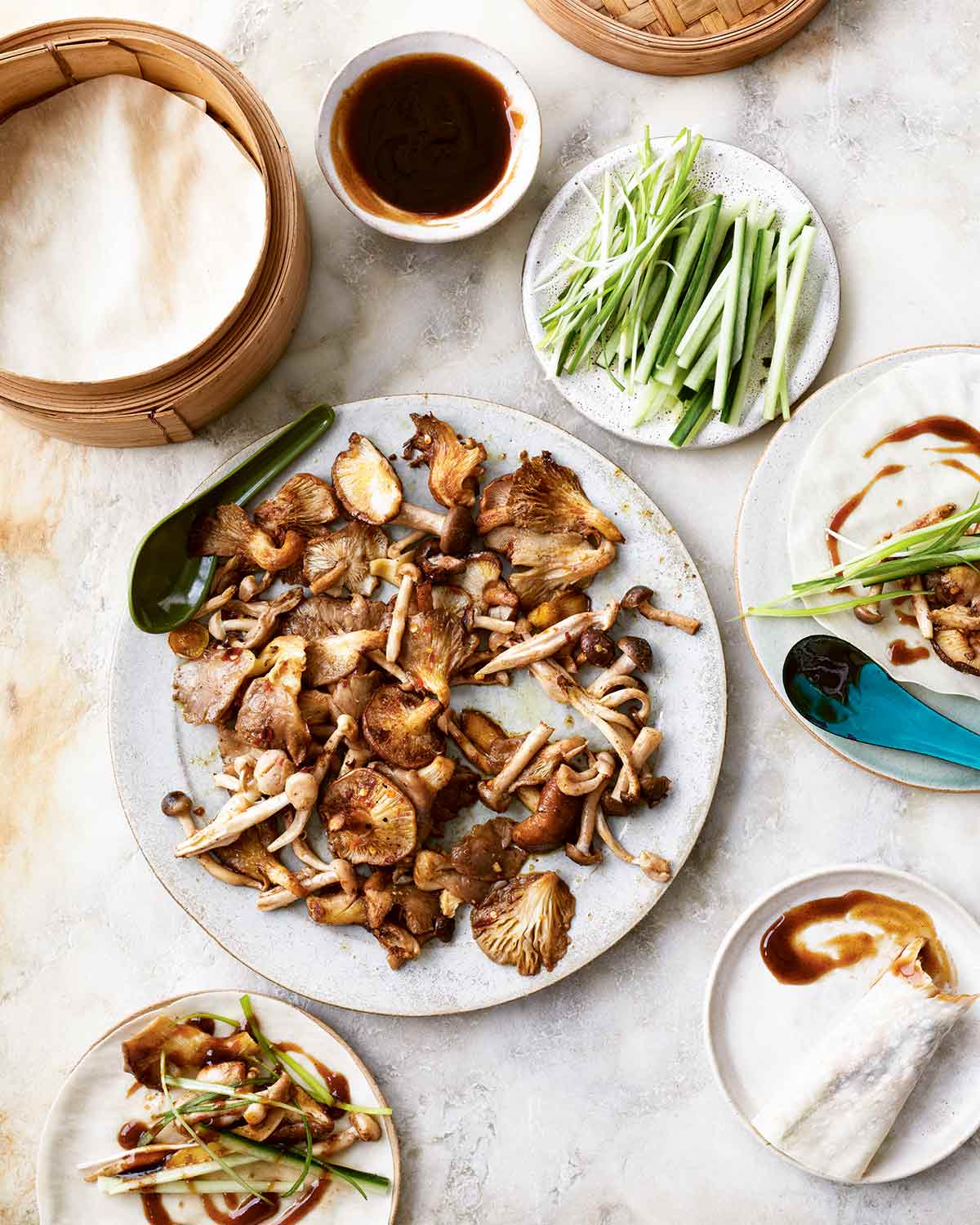 The components for Peking mushroom pancakes in individual dishes on a table.